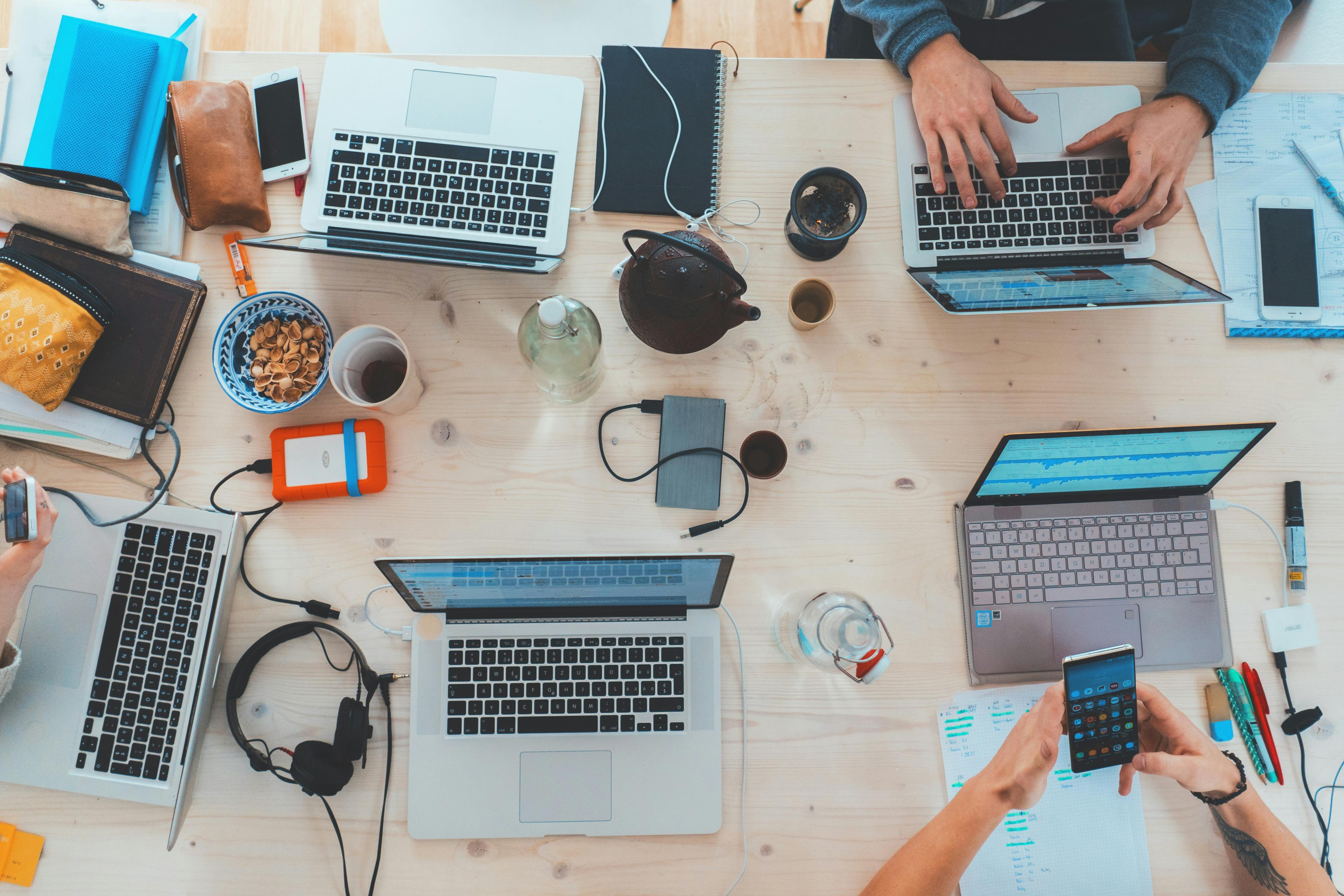 Sales team using voice technology and CRM software in a modern office