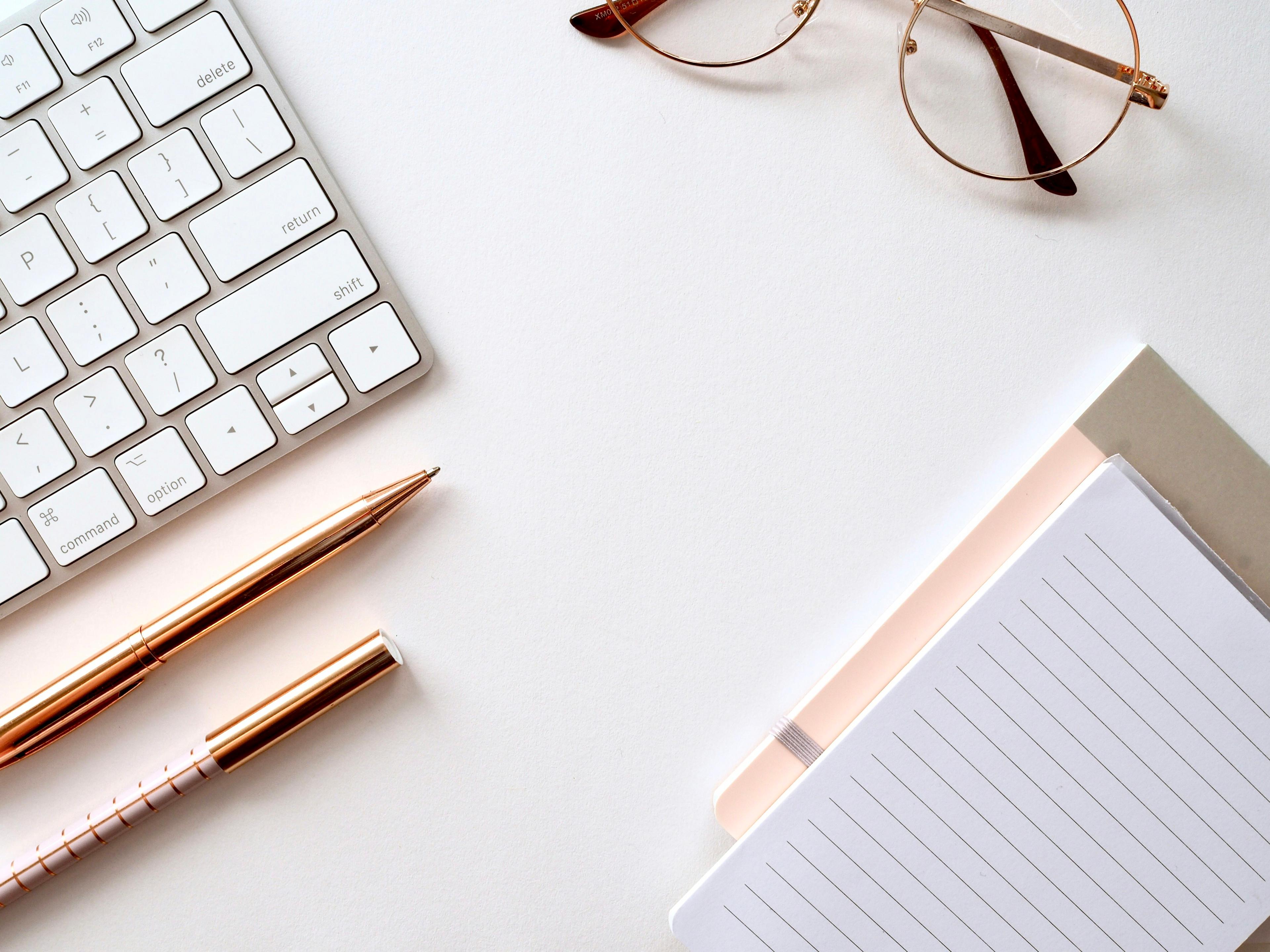 Pen and documents on a desk representing business proposal preparation and automation