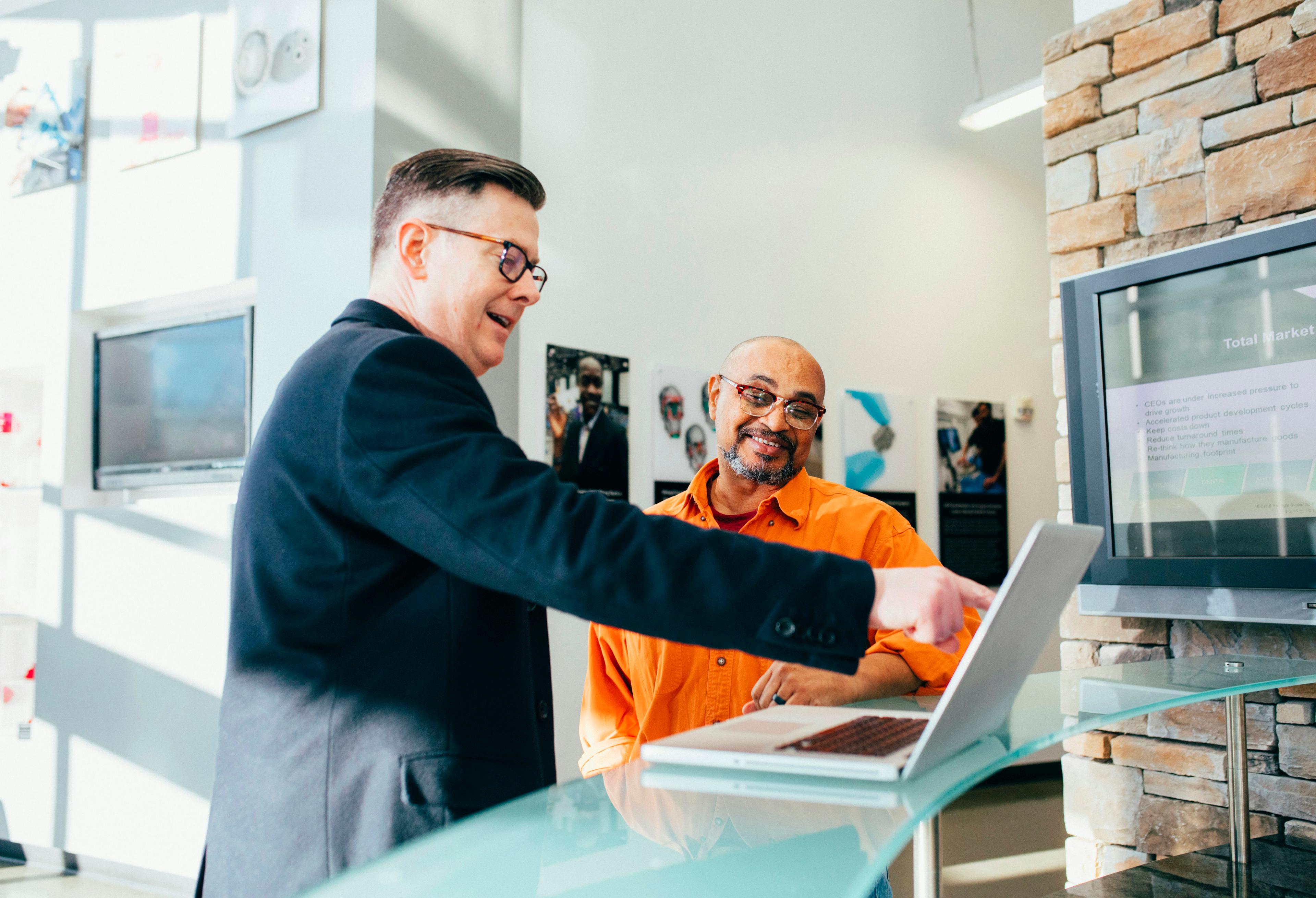 Sales professional analyzing data on a laptop representing conversation intelligence and sales analytics