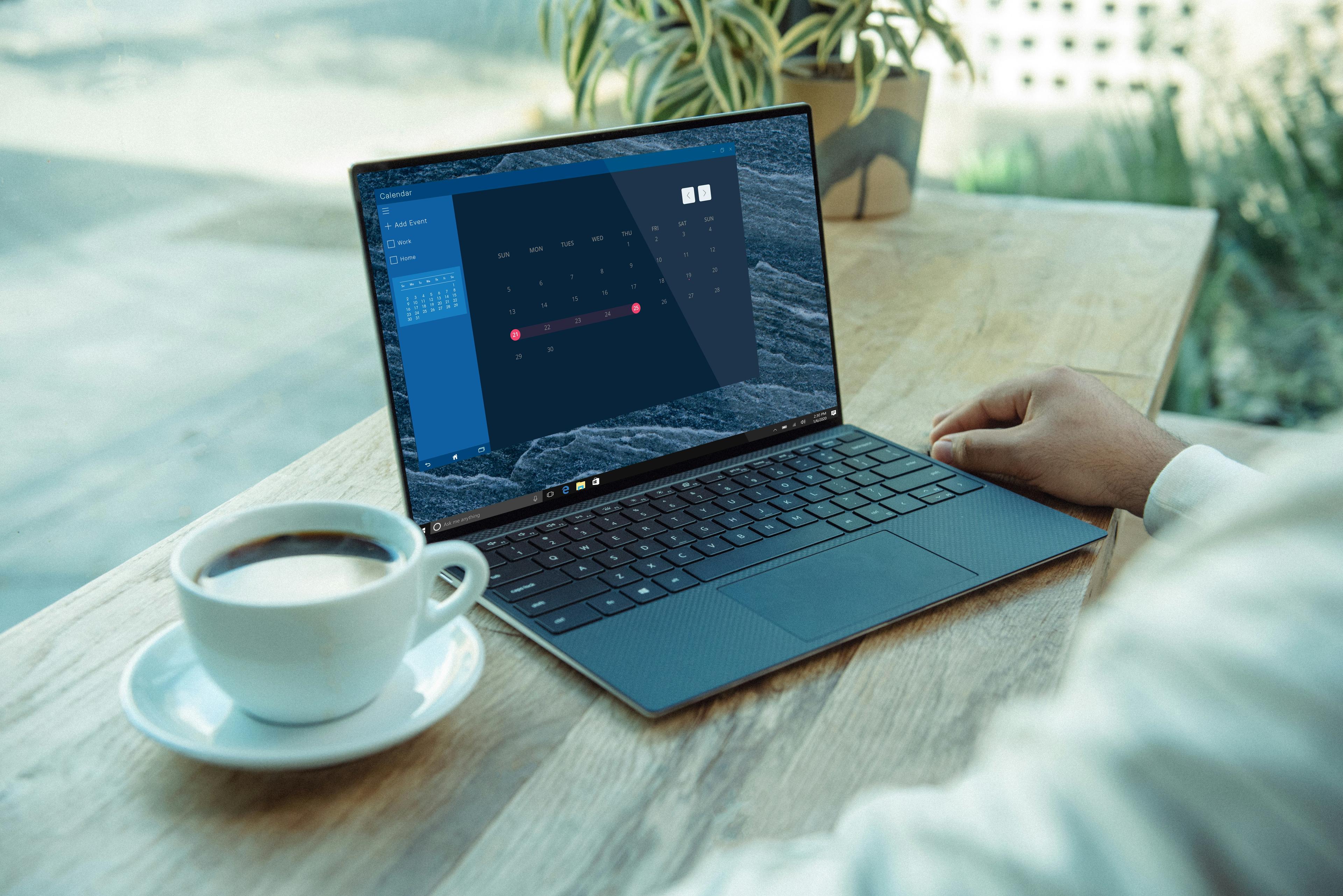 Person working on a laptop at a wooden desk, representing small business automation and productivity